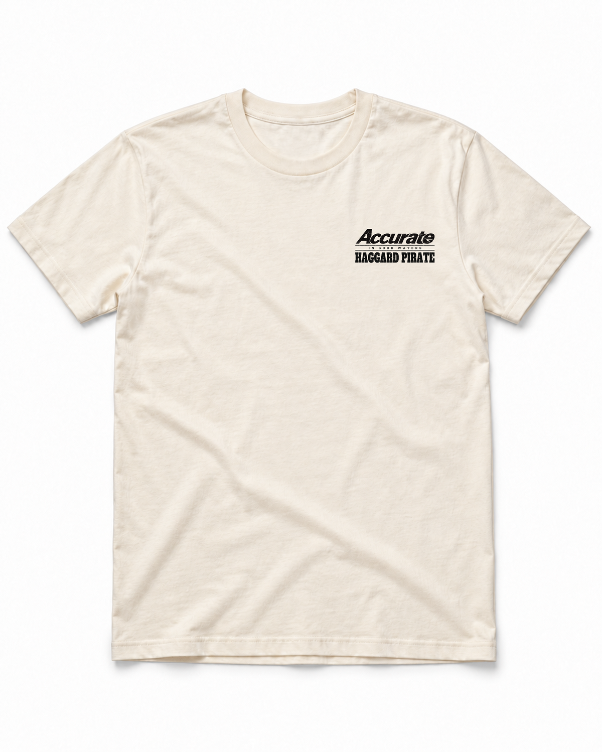 Accurate × Haggard Pirate Natural tee — front view with small black collaboration chest print