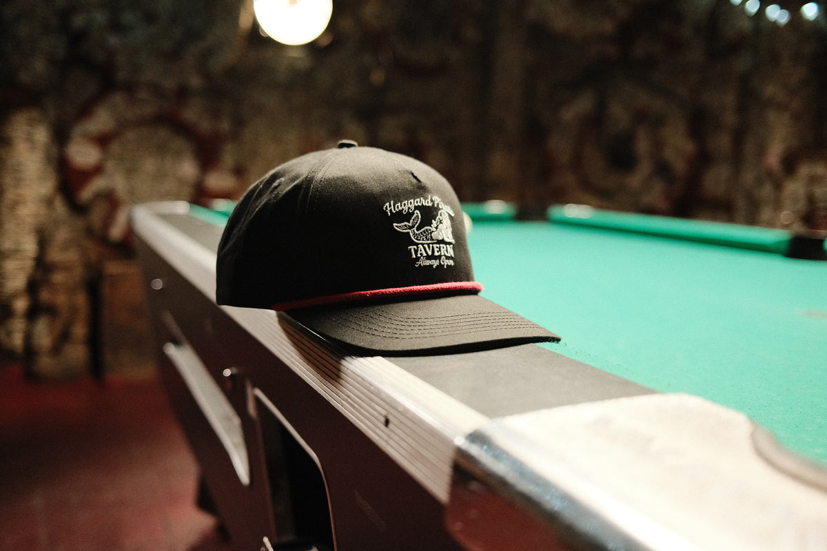 Portside Tavern Snapback - Black — Alaska trip lifestyle photograph, view 1